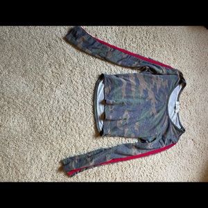 A cropped long sleeve camo shirt